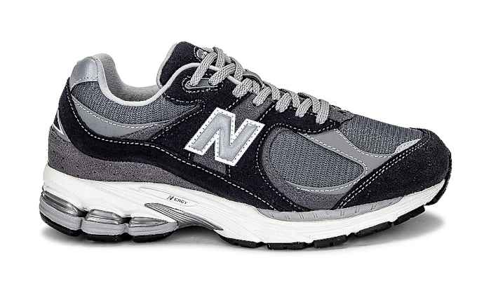 Side view of a grey and black New Balance sneaker.